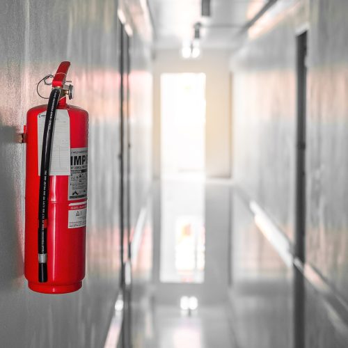 Fire extinguisher system on the wall background,